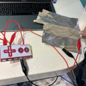 I used the grounding wire and connected it to the conductive cloth, then connected the red wire to the key. Placing the key on the cloth completed the circuit.